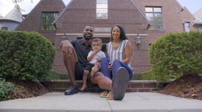 Calvin Johnson with his wife Brittney and son C.J.